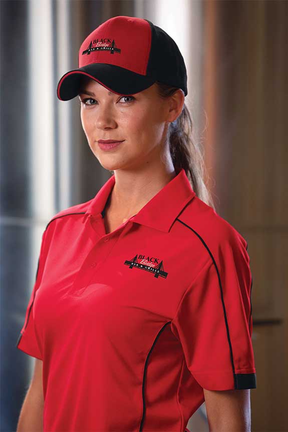 man wearing shirt with embroidered logo
